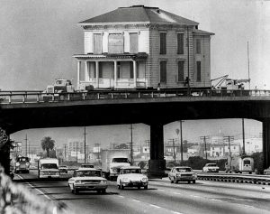 Oct. 22, 1973: An early 1900s house in Oakland looms over the Nimitz Freeway in Oakland after stopping on an overpass.